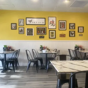 Framed pics on one wall.