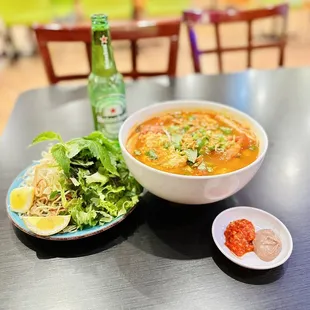 a bowl of soup and a plate of salad