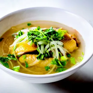 a bowl of soup with meat and vegetables