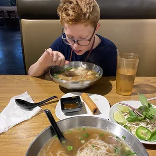 Chicken pho for my son, brisket pho for me, and some delicious spring rolls.