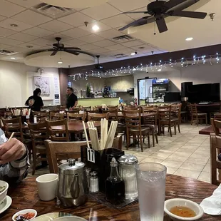 a man sitting at a table in a restaurant