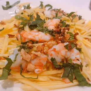 a plate of pasta with shrimp