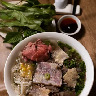 a bowl of soup with meat and vegetables
