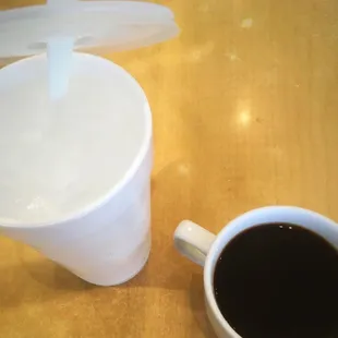 a cup of coffee and a spoon