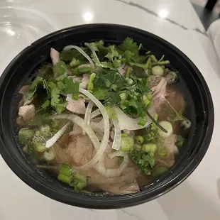 Her pho w/ flank steak