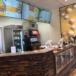 a restaurant counter with menus