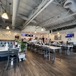  a dining area with tables and chairs