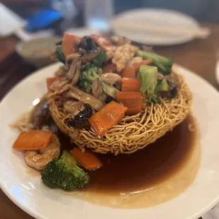 a plate of noodles and vegetables