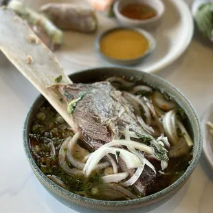 Spicy hue soup - bun bo hue. Huge bone lol