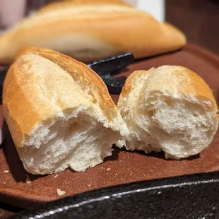 A baguette, torn in two.