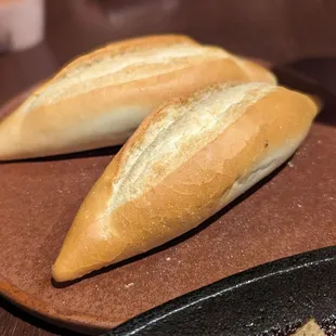 Two baguettes, served alongside the bò né.