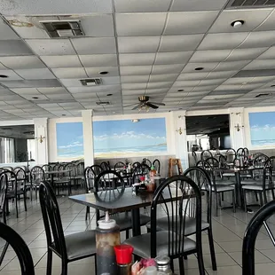a restaurant with tables and chairs