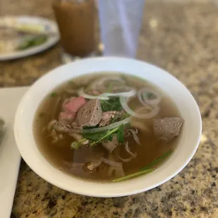 a bowl of beef and noodles