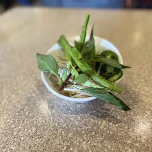 Basil, culantro, jalapeños, lime, and bean sprouts for the pho