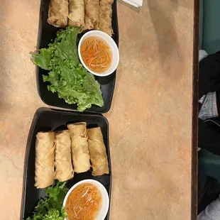 two trays of food on a table