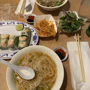 a bowl of soup and a plate of noodles