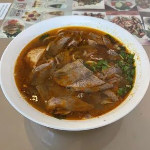 Bun Bo hue before being mixed around and adding the greens