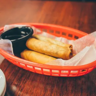 a basket of food and a cup of coffee