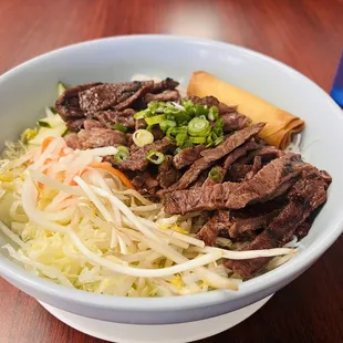 a bowl of beef and noodles