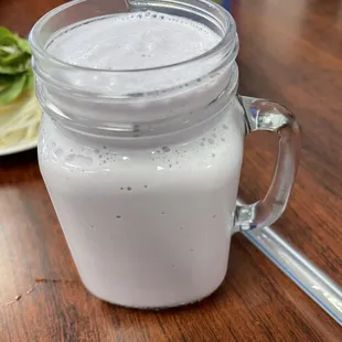 a glass of milk on a table