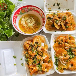 Bánh khọt: crispy Vietnamese mini pancakes with shrimp, coconut, and scallions. Served with fresh greens and tangy dipping sauce. A must-try