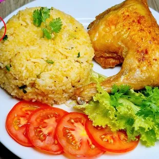Cơm Gà Xối Mỡ--crispy golden chicken served over fragrant rice, topped with savory sauce and fresh herbs. A flavorful Vietnamese classic!