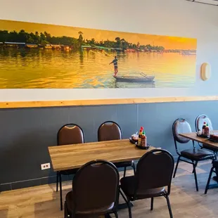 a dining area with tables and chairs