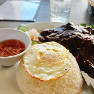 Pork chop with sunny side up egg and white rice