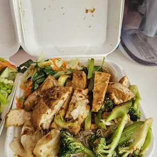 chicken and vegetables in a styrofoam container