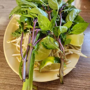 Thai basil, corriender, limes, bean sprouts jalapeños