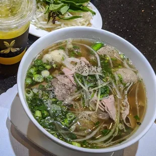 Freshly cooked noodles with their freshly squeezed OJ! One of my favorites!  (combination w/ side of beef ball)
