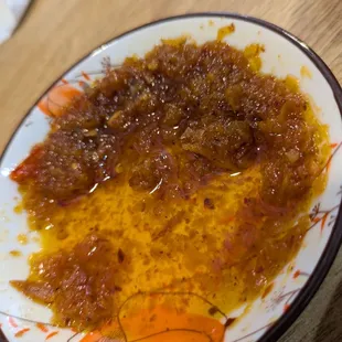 Home made chilli oil. Yummy, and very very different than any other place. A must try