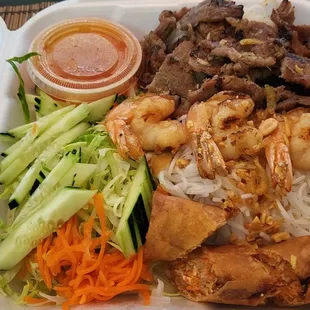 Vermicelli bowl with shrimp, pork and spring roll.
