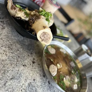 a bowl of soup and a spoon of soup