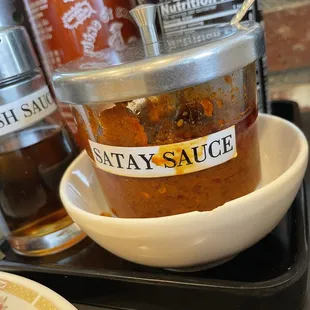 a jar of sauce on a tray