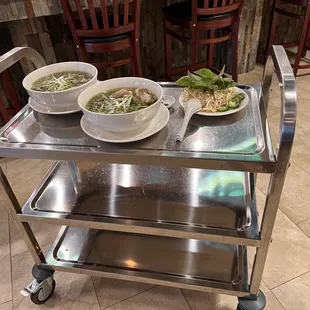 Such a cute little rolling cart that they bring everything out on! I love this touch!