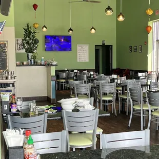 a dining room with tables and chairs