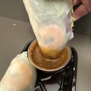 a person holding a bag of food