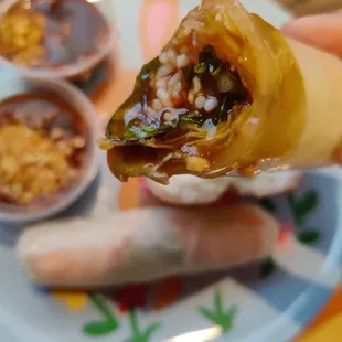 Summer roll dipped in sauce