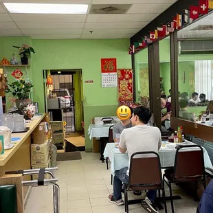 people sitting at tables in a restaurant