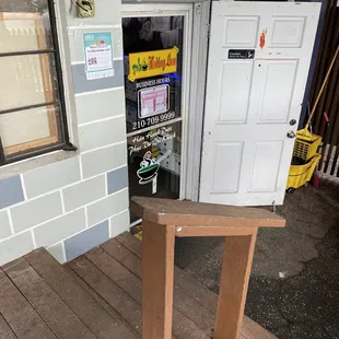 a wooden table in front of a door