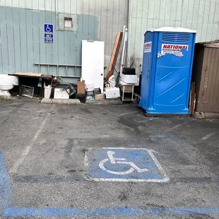 Portapotty in the parking lot where the older server told my husband to go and use.