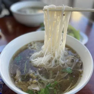 a bowl of soup with noodles