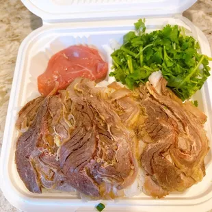 a meal in a styrofoam container