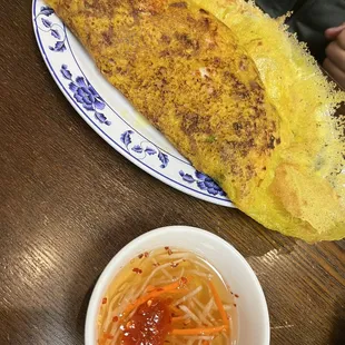 an omelet and a bowl of soup