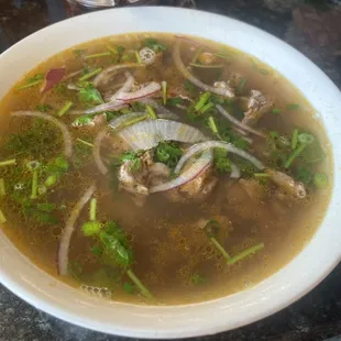 Trying some Houston pho.  Flavorful broth with sate and peanuts.  House chili oil smells of lemongrass