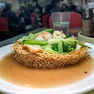 #62 crispy seafood noodles $16. Mediocre. Where's the rest of it?