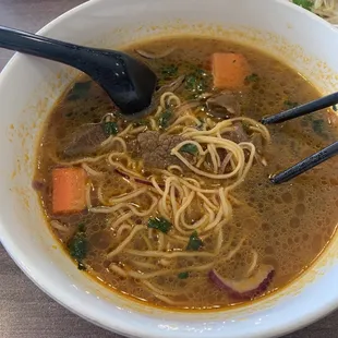 Beef Stew with instant noodle, tough beef, and undercooked carrots. I couldn&apos;t finish it