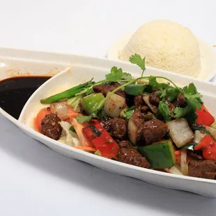 #89  Stir fried shaken filet mignon  over salad serve with steam rice