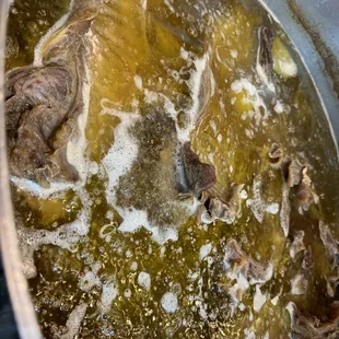 Cooking the broth for beef noodle soup